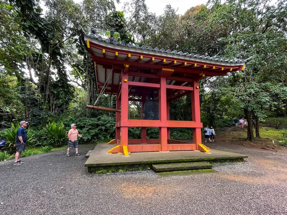this is a large red Japanese architectural bell called the Bon Sho at Byodo-In Temple in Oahu